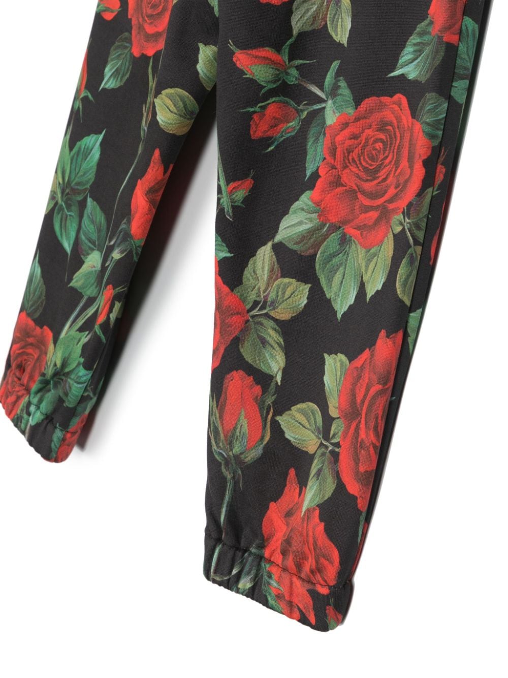 Pantalón con print rosas y con logo en la cinturilla Dolce & Gabbana