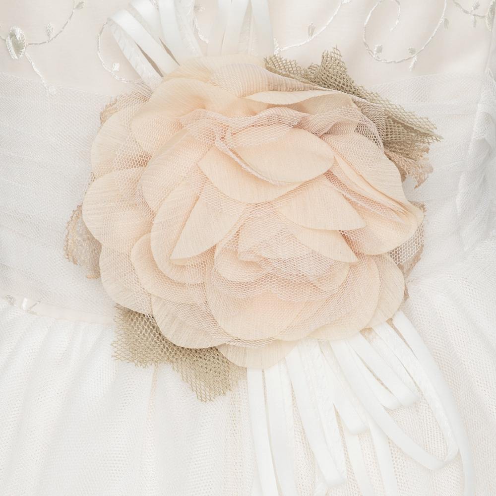 Vestido de comuniôn para niña con una flor y lazada nude de Marla - Modini Shop